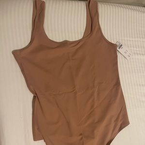 Tan body suit